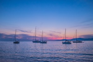 boats on a creamy pastel sea and sky