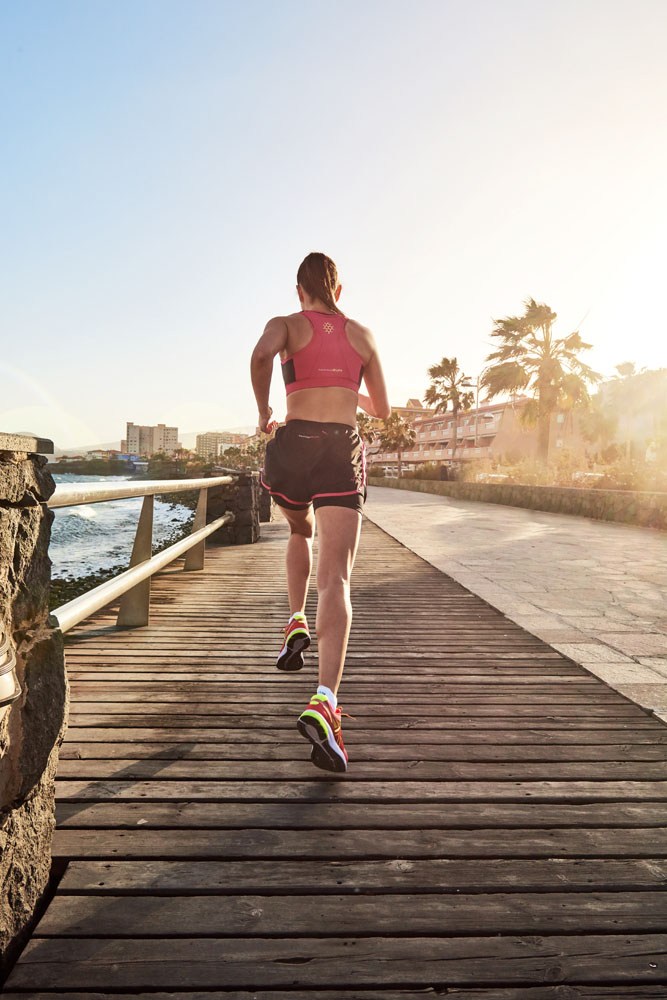 runner sunlight boardwalk location photographer